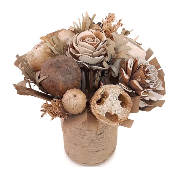 Arrangement AR52: a compact, earthy arrangement of natural sola flowers, dried pods, a loofah slice and palm-leaf strips