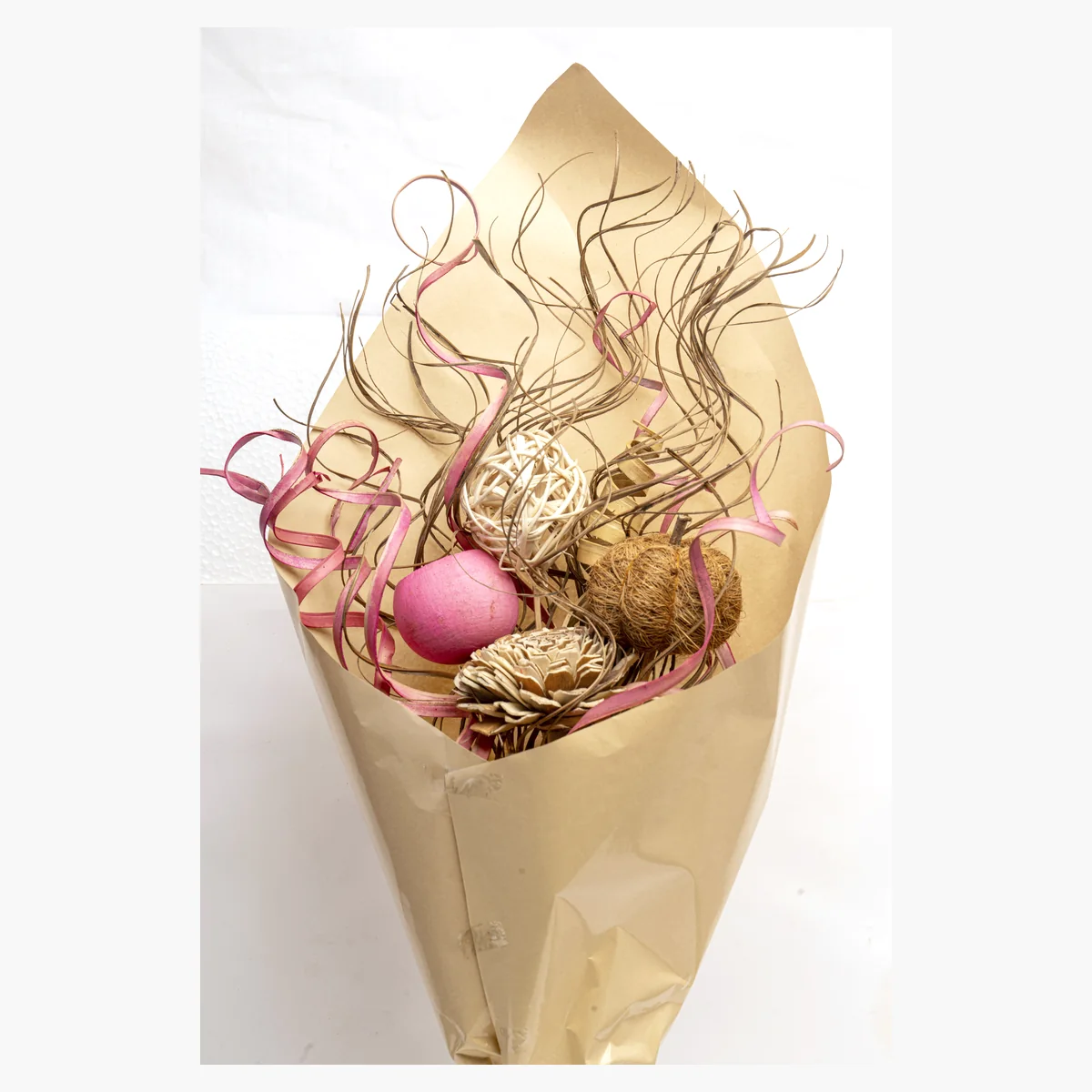 Kraft-Wrapped Dried Bouquet – Pink AR80: a pink and natural kraft-wrapped dried bouquet with rose-pink curled palm – view 2