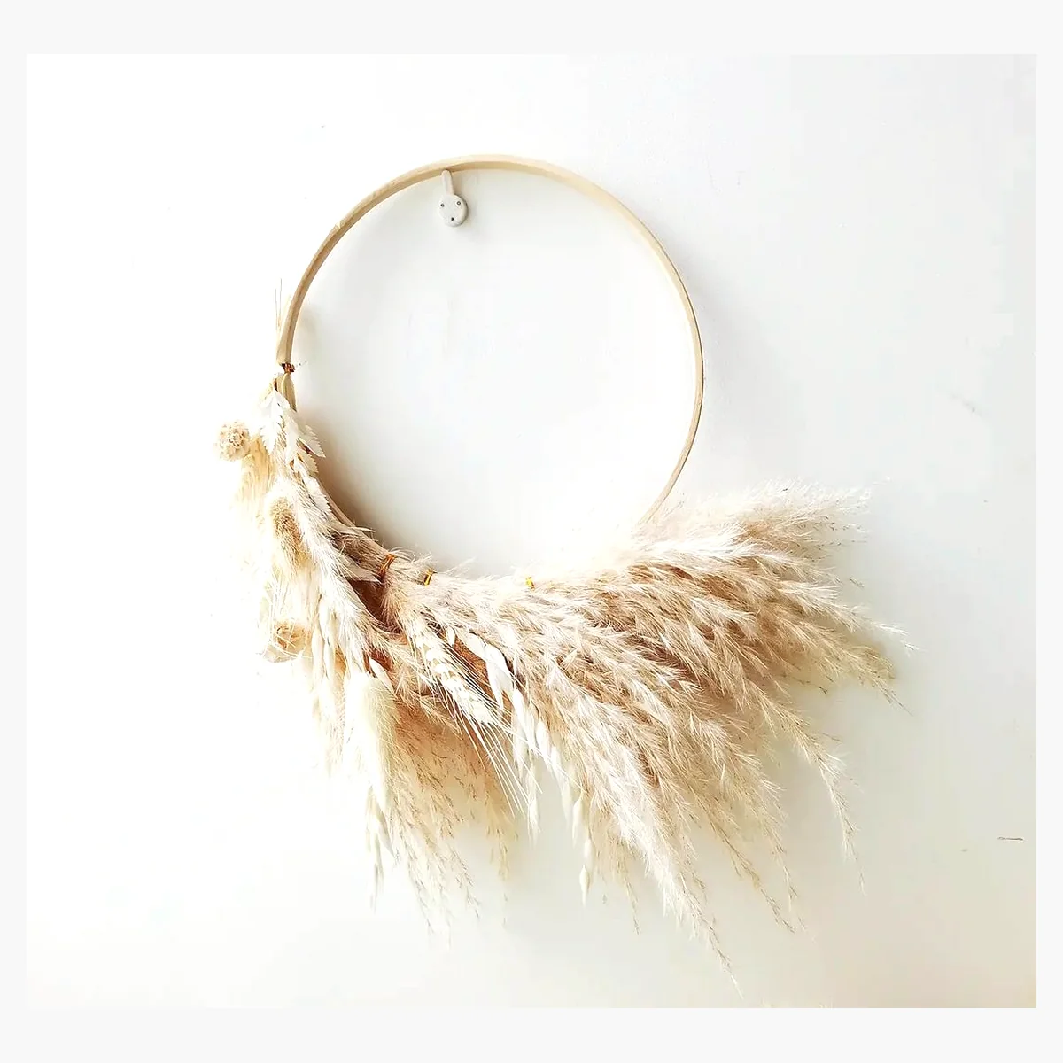 Pampas Hoop Wreath HM24: a handmade wall hoop with a sweeping crescent of feathery pampas plumes