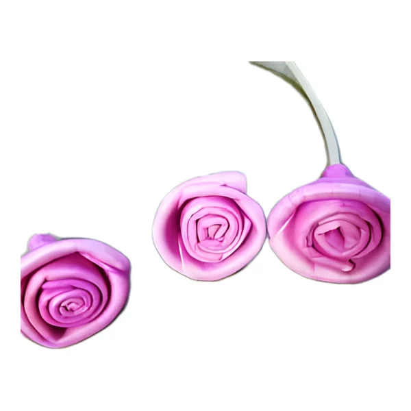 Sola Ring Rose Pink SO74: a dyed pink version of the hand-rolled ring rose, with a spiral centre
